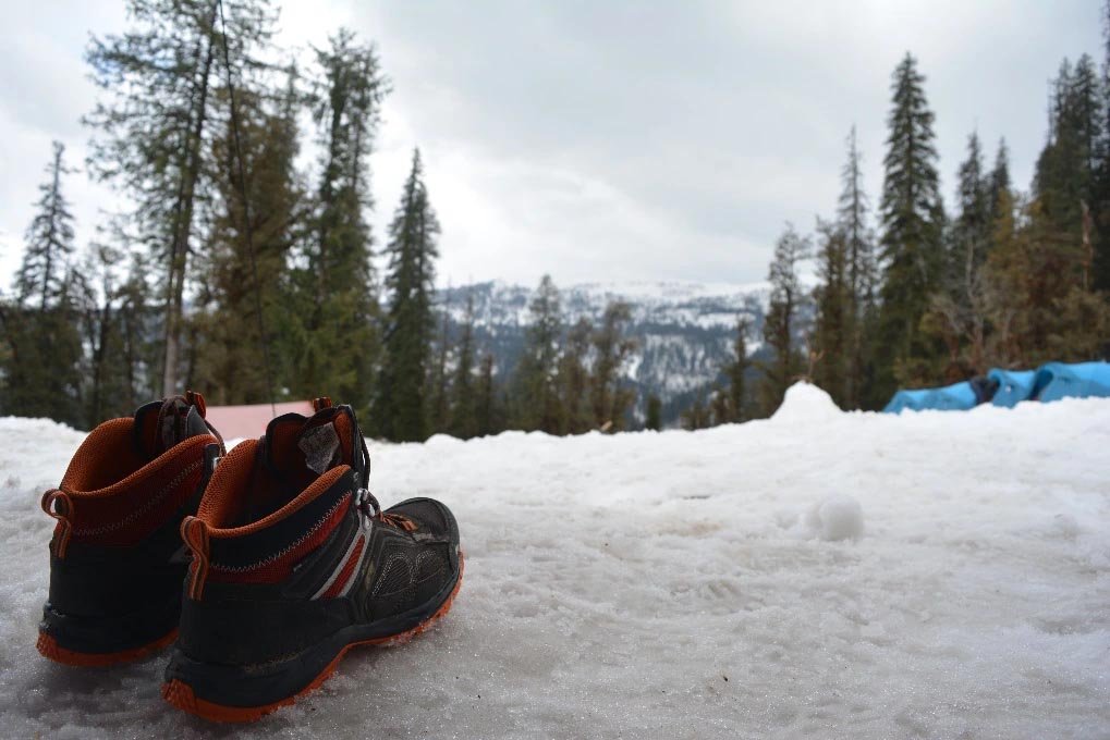 Trekking boots and outdoor essentials